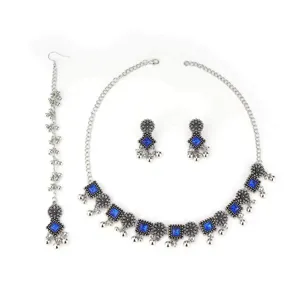 Bohemian ethnic silver blue crystal jewelry set, detailed necklace earrings and headpiece.