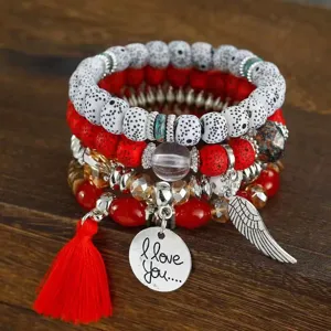 Bohemian multi-layer beaded bracelet set with red tassel and vintage metal charms.