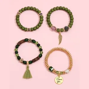 Set of 4 bohemian green beaded bracelets with tassel and charms for women fashion jewelry.