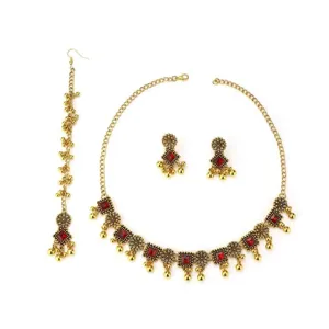 Detailed close-up view of bohemian ethnic style gold necklace earrings and head jewelry.