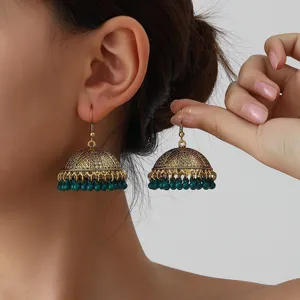 Ethnic style golden jhumka earrings with green bead dangles, vintage hook design for women.