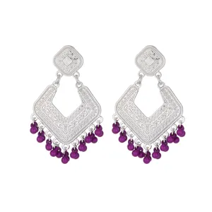 Detailed view of vintage silver-tone hollow chandelier drop earrings featuring purple bead fringe.