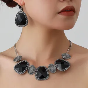 Vintage style black gemstone geometric necklace and earrings set detail showcase.
