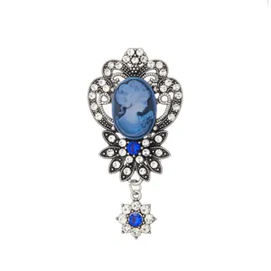 Exquisite blue cameo brooch detail with clear rhinestones set in vintage silver metal.