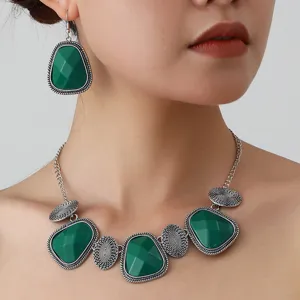 Detailed close-up view of a retro green stone necklace and matching drop earrings set.