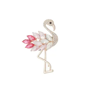 Detailed close-up of the elegant rhinestone flamingo brooch featuring sparkling pink and clear crystals.