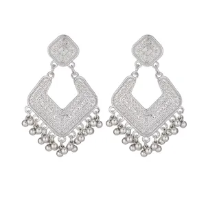 Exquisite silver vintage drop earrings with intricate hollow-out carvings and dangling beads.
