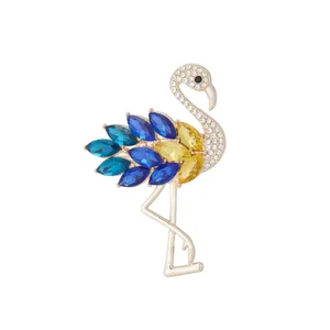 Detailed close-up view of elegant flamingo brooch featuring sparkling multicolored crystals.