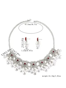Bohemian vintage silver alloy faux pearl necklace and earrings set with red stones.