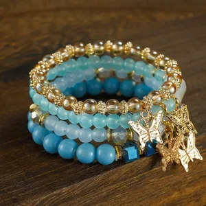 Bohemian crystal layered butterfly beaded bracelet, exquisite fashion jewelry for women detail shot.