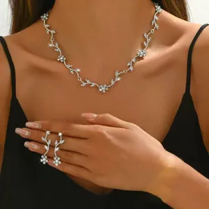 Elegant rhinestone leaf necklace and earrings jewelry set for women, sparkling crystal.