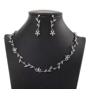 Rhinestone leaf necklace and earrings set, elegant silver crystal jewelry for women.