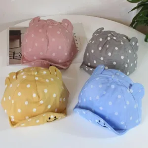 Cute kids polka dot baseball cap with cute bear ears and smiley brim for summer outdoor fun.