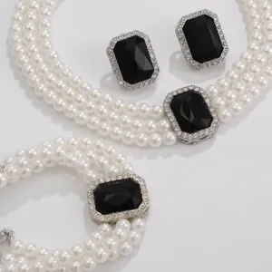 Stunning multi-layer pearl necklace bracelet and earrings detail set, vintage black gem design.