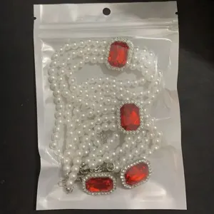 Multi-layer pearl necklace set with red crystal square pendant, elegant retro fashion style.