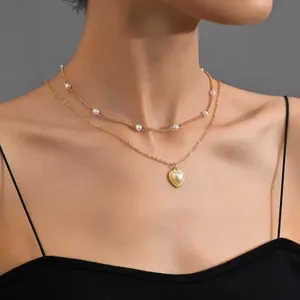 Collar de perlas de doble capa con colgante de corazón, joya dorada elegante para mujer.