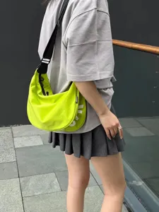 Casual canvas crossbody dumpling bag for daily travel, comfortable crescent shape design.