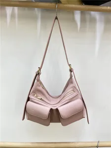 Pink motorcycle style shoulder bag with double front pockets and zippers for daily use.