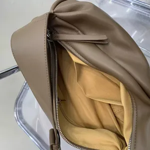 Minimalist soft pleated crossbody bag for women, stylish brown casual shoulder bag.