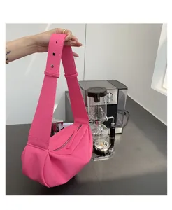 Bright pink shoulder bag for women, stylish wide strap hobo bag with ruched design and soft material.