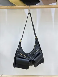 Black motorcycle style crossbody shoulder bag with multi pockets and metal zippers for women.