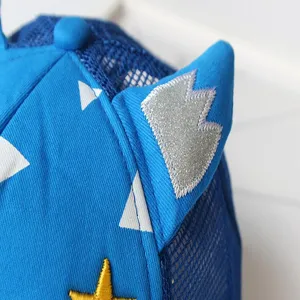 Kids blue mesh baseball cap detail view, featuring cute bull horns and star embroidery.