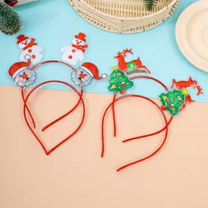 Closeup of cute Christmas element headbands, featuring plastic Santa and reindeer holiday props.