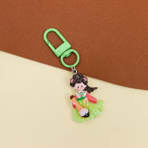 Detail shot of cute ancient Chinese style girl resin keychain accessory with green clasp.