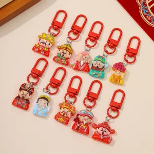 Detailed view of cute resin God of Wealth keychains, vibrant colors, festive design.