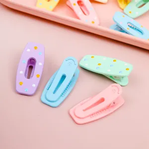 Pastel macaron duckbill hair clips detail, cute seamless hair accessories for sweet styling.