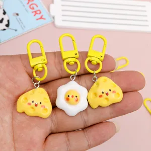 Cute cheese and fried egg keychains, fun resin cartoon pendant bag charms for gifts.