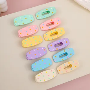 Macaron color polka dot duckbill hair clips detail view, cute seamless hair accessories.