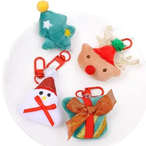 Cute Christmas plush keychain set including tree reindeer snowman and gift box for holiday decor.