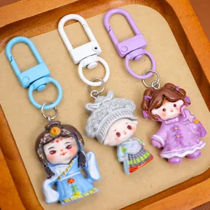 Cute ethnic style resin cartoon girl keychain pendant, creative DIY cream glue accessories.