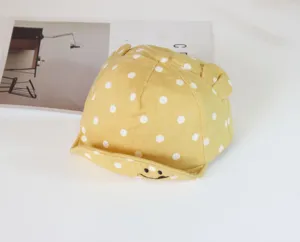 Cute yellow baby baseball cap featuring white polka dots, cute ears and embroidery smile brim.