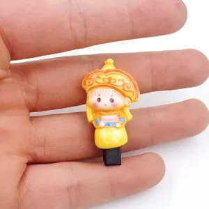 Detail view of a cute Chinese ethnic style character hairpin, small and exquisite accessory.