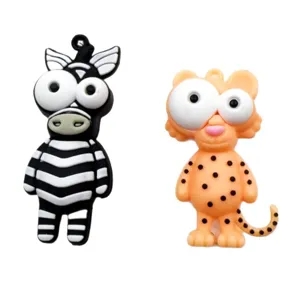 Cute cartoon big-eyed animal keychain pendants featuring a zebra and a leopard style design.