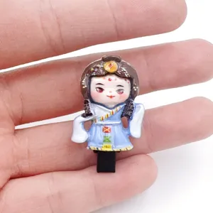 Detail view of a cute Chinese style traditional character figurine accessory, fine craftsmanship.