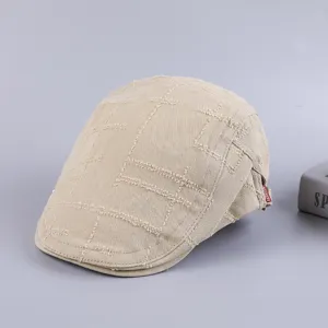 Men's casual cotton flat cap newsboy hat detail view showcasing retro distressed grid pattern.