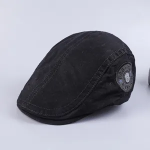 Classic black cotton flat cap for men, vintage style casual beret with side patch detail.