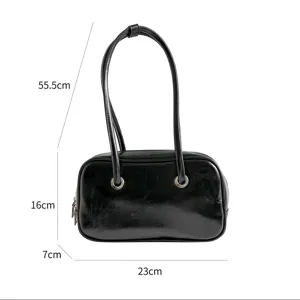 Retro oil-wax leather shoulder bag chic minimalist black pillow handbag with metal ring details.