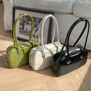 Detailed shot of retro oil-wax texture shoulder bags in olive, off-white, and black chic style.