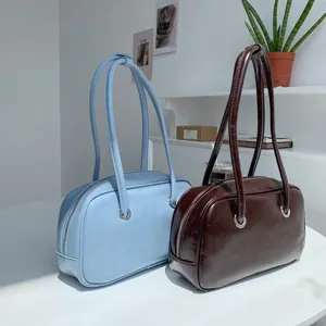 Retro oil-wax texture underarm shoulder bag, chic Boston pillow handbag for women.
