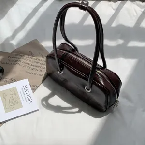 Retro oil-wax texture underarm bag, chic Korean style large shoulder pillow bag detail.