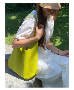 Detail view of the yellow soft leather hobo shoulder bag, featuring a relaxed daily style.