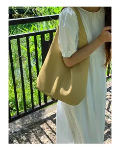 Casual soft leather shoulder bag scene showing slouchy design and large capacity for daily use.