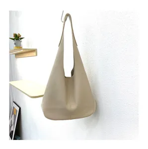 Soft leather beige hobo shoulder bag detail, casual slouchy tote purse for women everyday use.