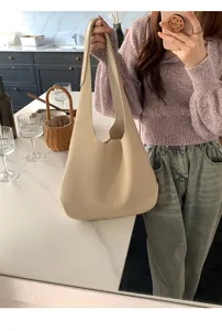 Minimalist solid color soft leather shoulder bag for women, casual daily tote and hobo style.