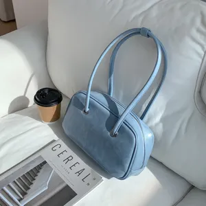 Vintage oil wax texture blue underarm shoulder bag lifestyle detail view with chic style.