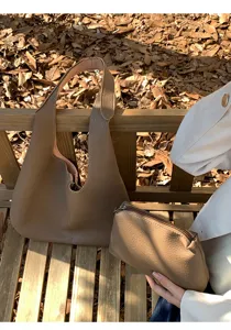 Soft leather hobo shoulder bag with small pouch, casual large capacity tote design.